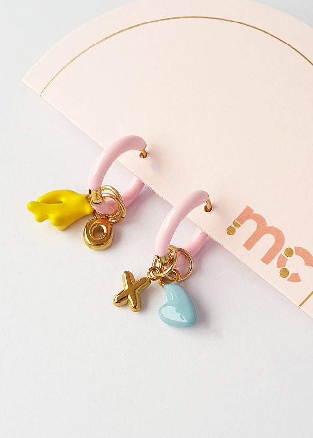 Middle Child Chunky XO Huggie Earrings in Pink